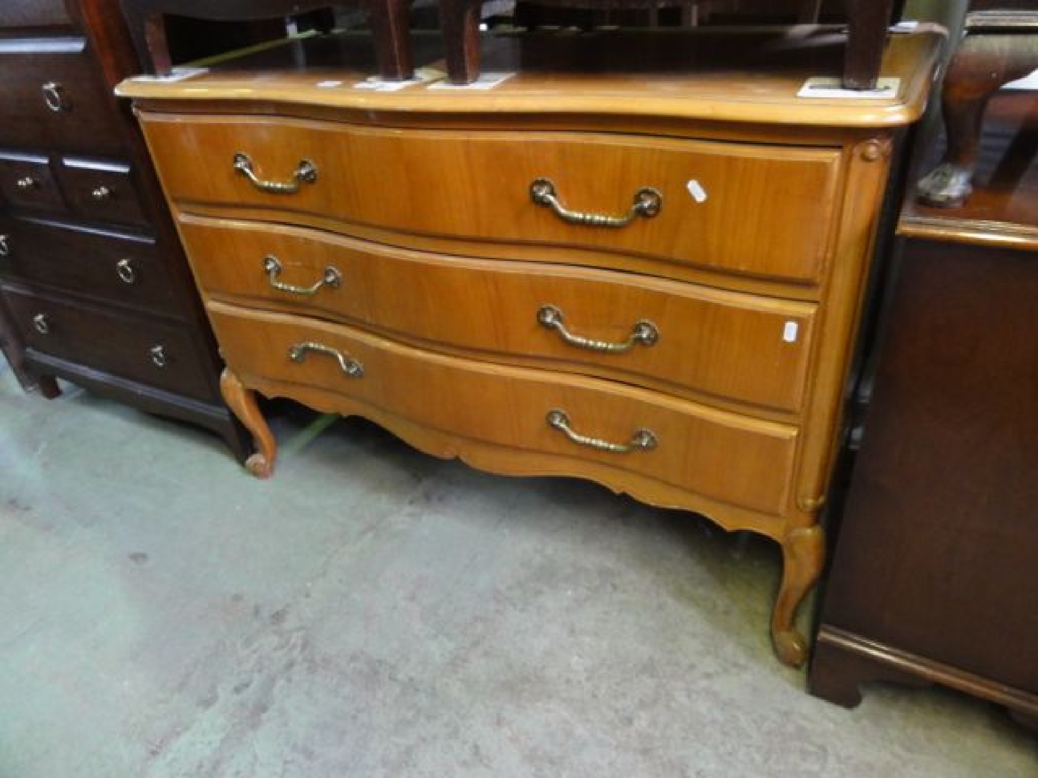 Appraisal: A cherry wood commode the serpentine front with moulded outline