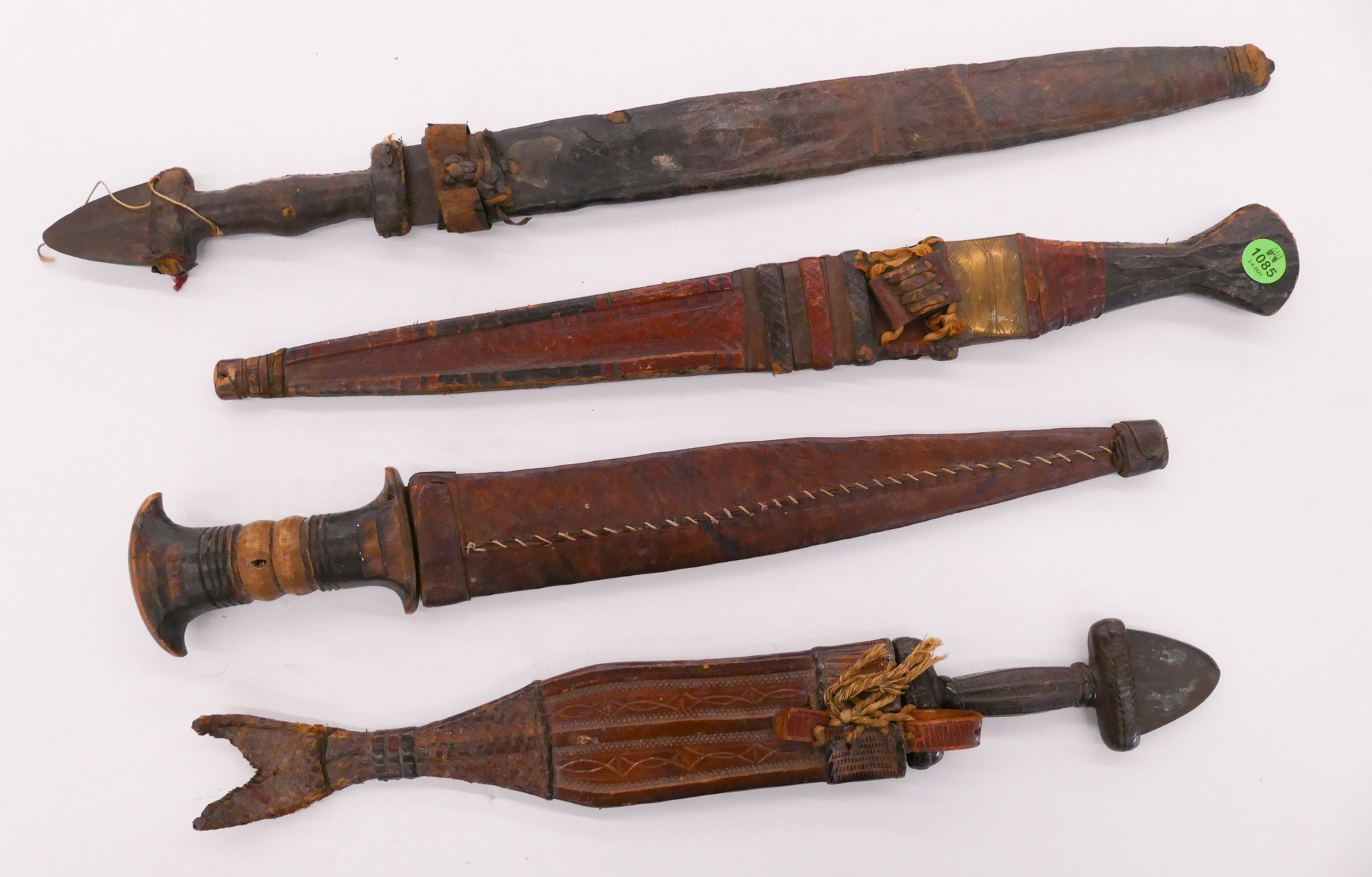 Appraisal: pc Old African Leather Sheathed Daggers- approx ''