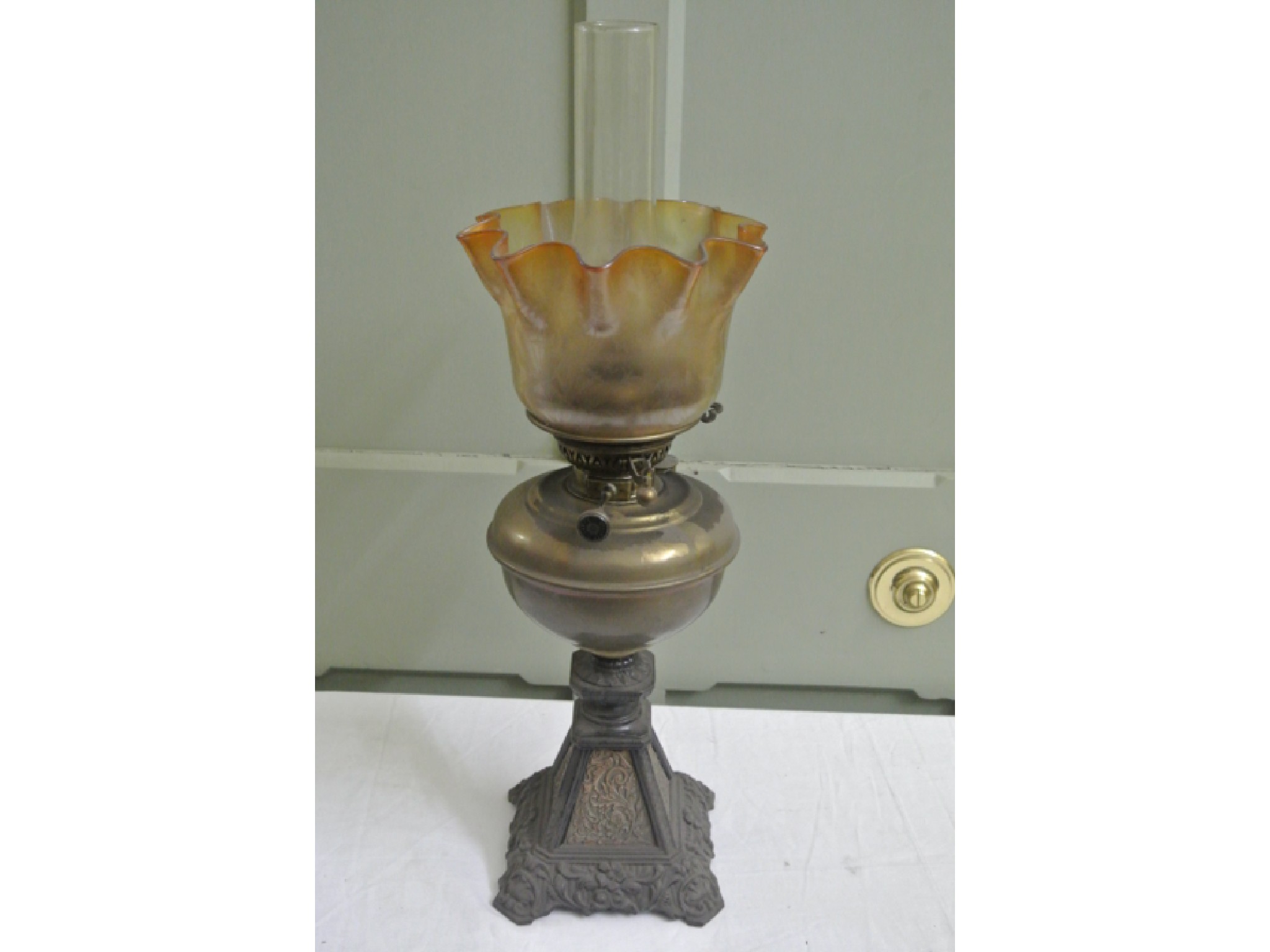 Appraisal: A Lampe Veritas Victorian oil lamp with decorative cast iron