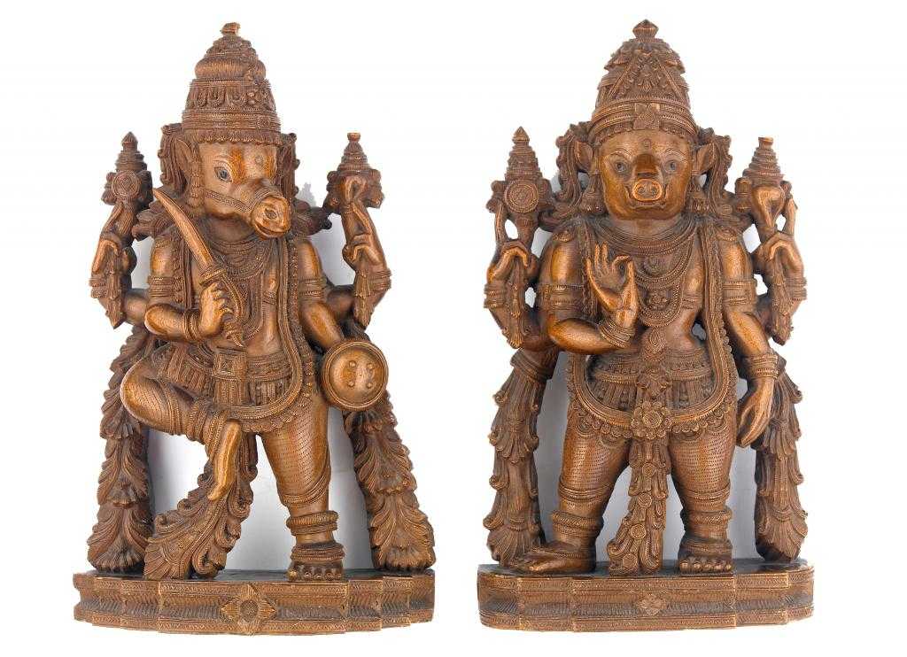 Appraisal: A PAIR OF INDIAN SANDALWOOD CARVINGS OF VISHNU MANIFESTED AS