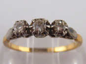 Appraisal: A yellow metal tests ct gold three stone diamond ring