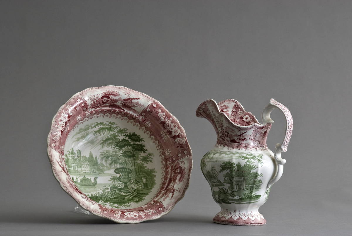 Appraisal: PINK STAFFORDSHIRE PITCHER AND BOWL WITH GREEN LANDSCAPE DECORATION Diameter