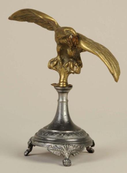 Appraisal: Eagle Form Brass Pot Metal Pocket Watch Holder Description With