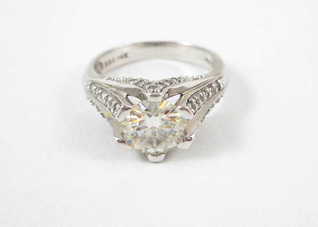 Appraisal: MOISSANITE DIAMOND AND FOURTEEN KARAT GOLD RING The white gold