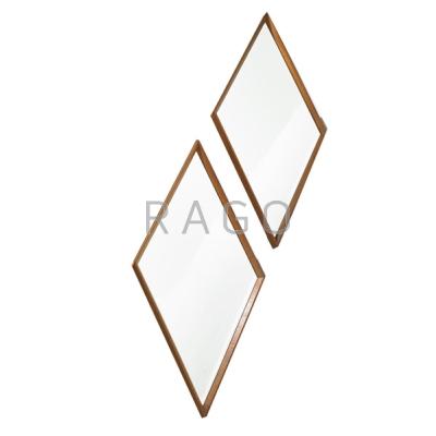 Appraisal: STYLE OF LA BARGE Pair of diamond-shaped wall mirrors USA