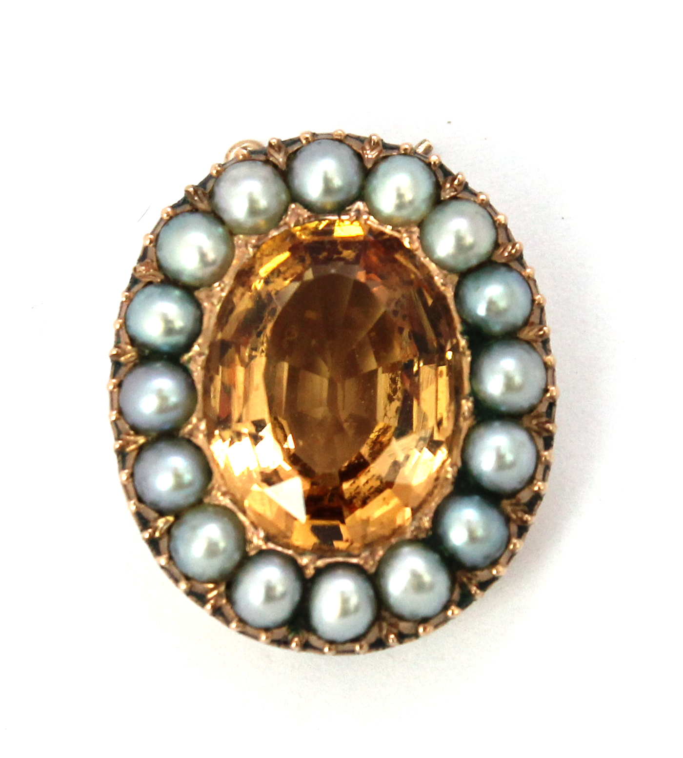 Appraisal: A gold topaz and half pearl set oval clasp mounted