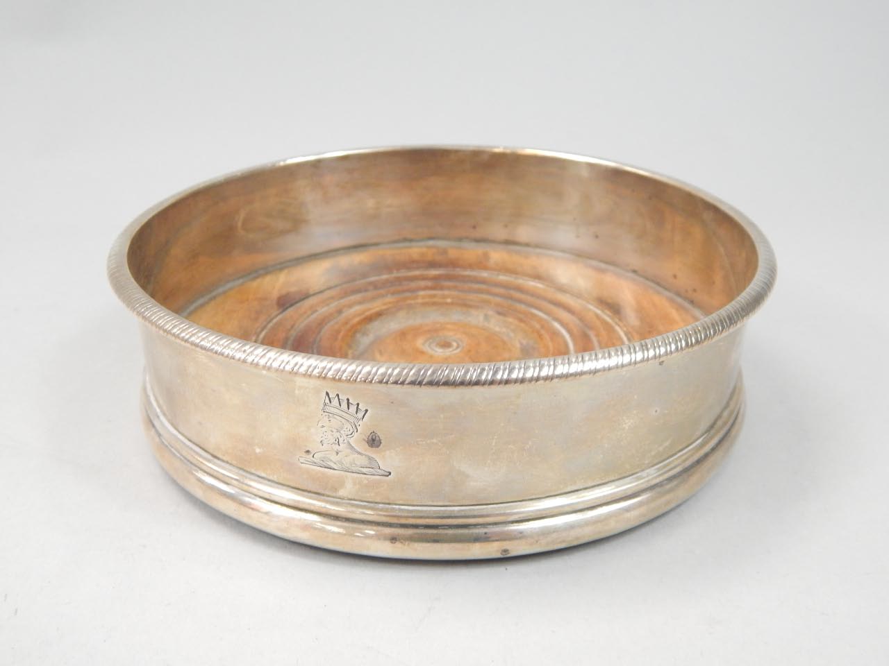 Appraisal: A George III silver wine coaster of plain form with