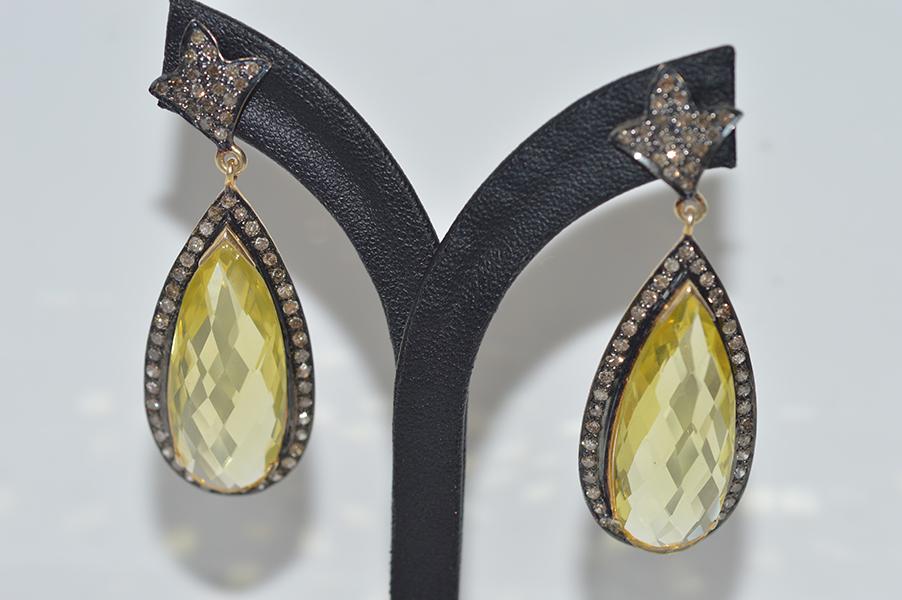 Appraisal: A PAIR OF LEMON QUARTZ AND DIAMOND DROP EARRINGS IN