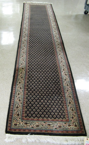 Appraisal: HAND KNOTTED ORIENTAL RUNNER Indo-Persian Mir design of repeating tiny