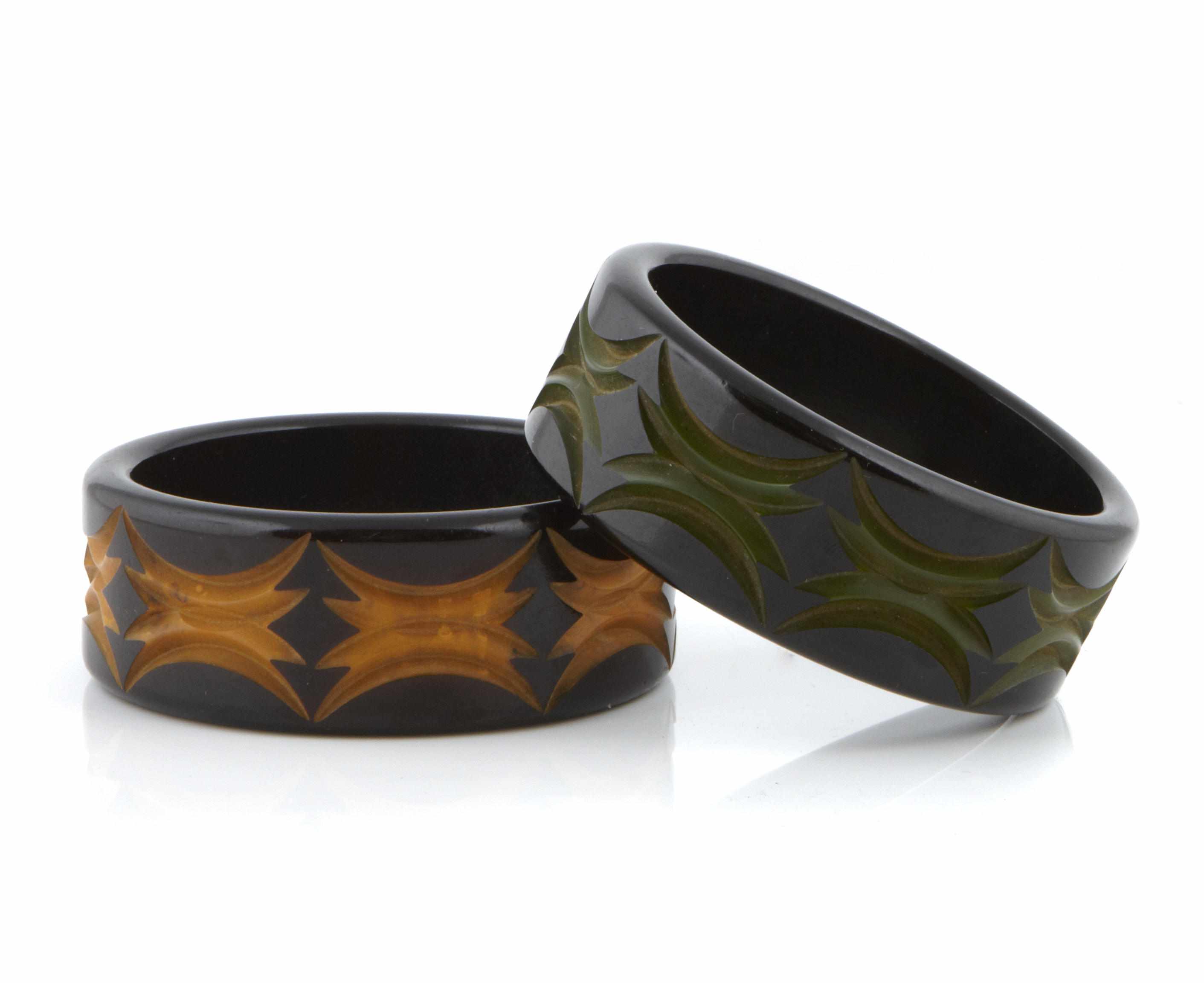 Appraisal: Two two-tone cast carved Bakelite bangle bracelets each diameter in