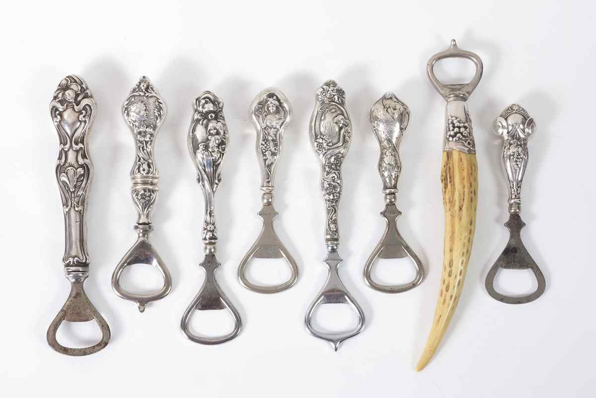 Appraisal: ART NOUVEAU STERLING HANDLE BOTTLE OPENERS An assembled collection to