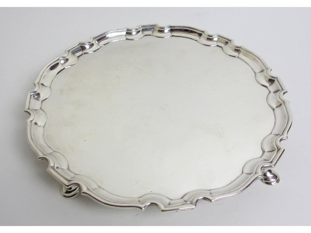 Appraisal: A George II silver salver of circular scalloped form on