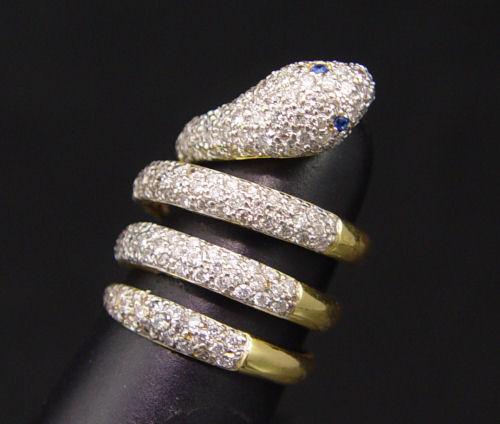 Appraisal: K DIAMOND ENCRUSTED SNAKE FORM RING K yellow gold ring