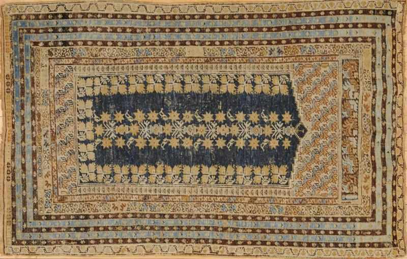 Appraisal: TURKISH BLUE-GROUND PRAYER RUG Worked with floral poles within tan