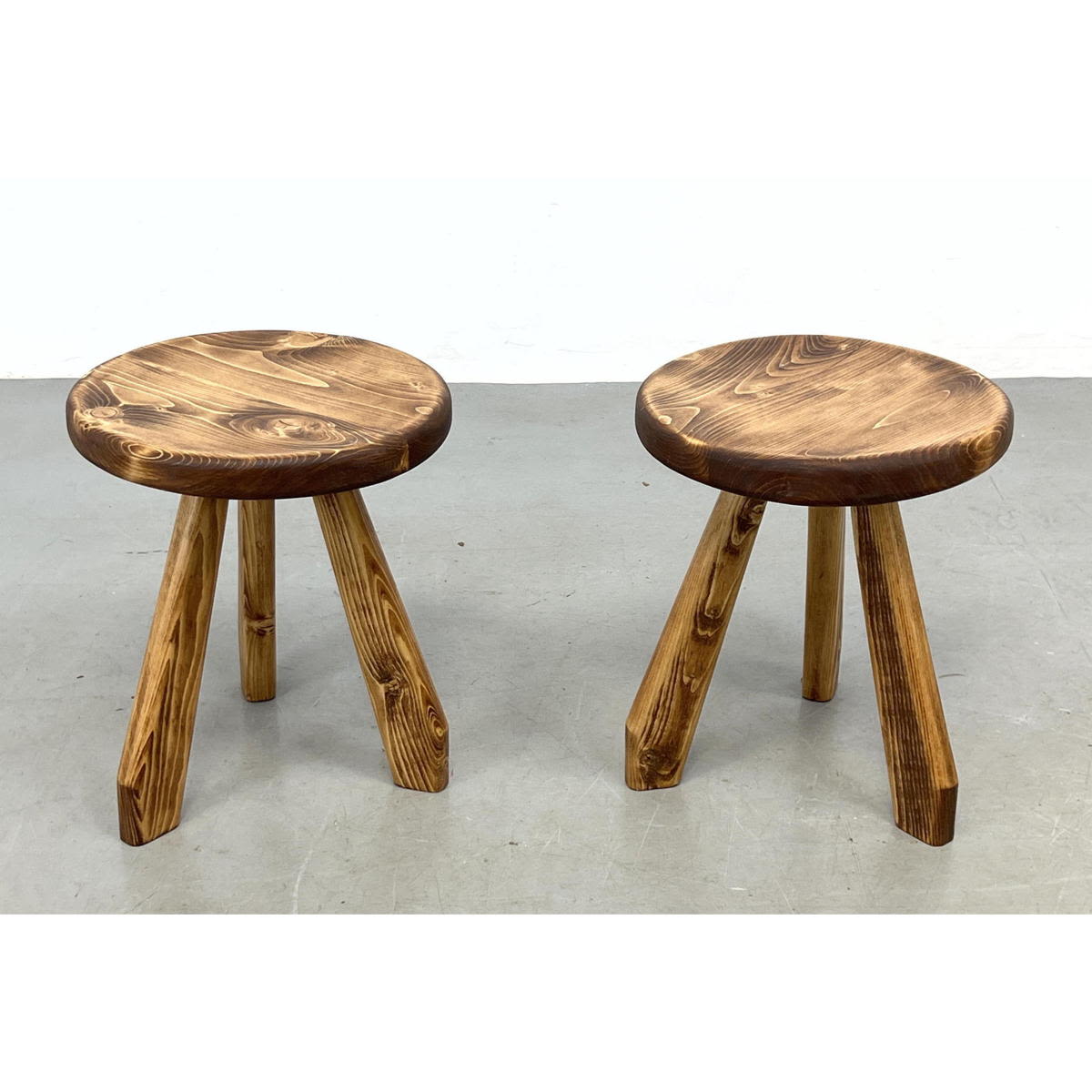 Appraisal: Pr Charlotte Perriand Style stools Three legged Primitive style Dimensions