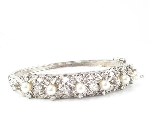 Appraisal: A cultured pearl diamond and fourteen karat white gold bangle