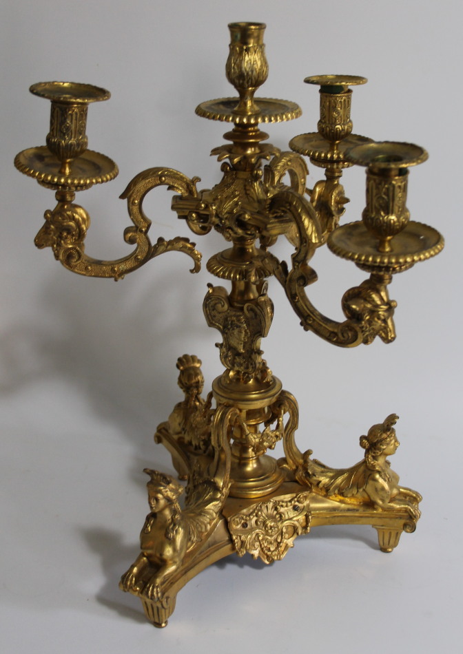 Appraisal: A Regency ormolu candelabrum with three acanthus capped scrolling arms