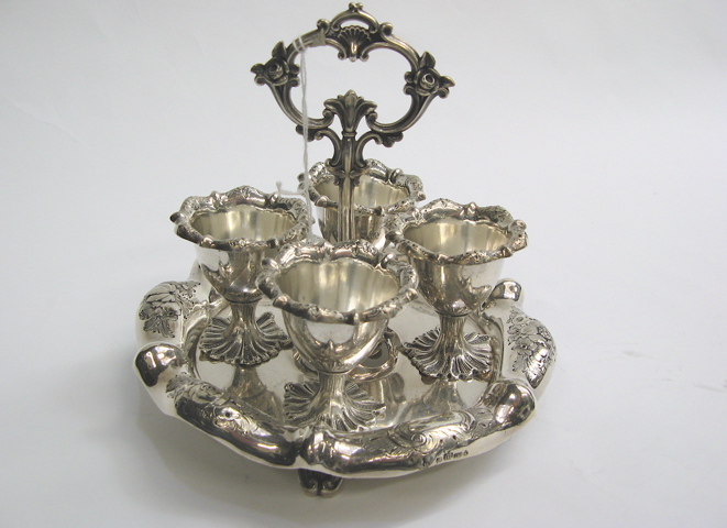 Appraisal: ENGLISH SILVER PLATED EGG CUP CASTER SET with four inch