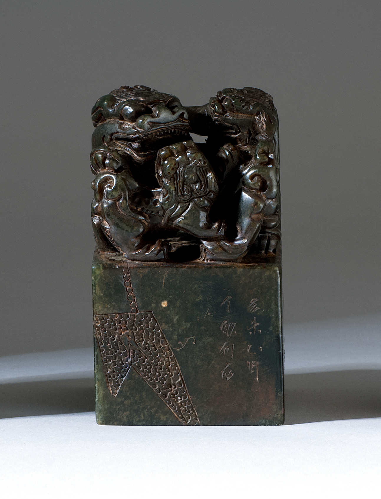 Appraisal: BLACK SOAPSTONE SEAL In square form with triple lion finial