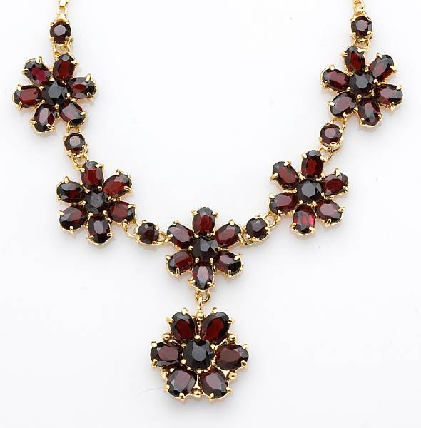 Appraisal: A garnet and k gold necklace length in