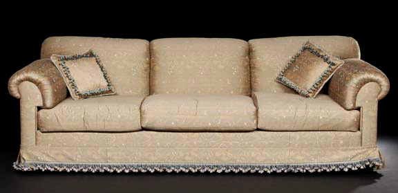 Appraisal: Contemporary Upholstered Sofa the trisected padded back joined by outscrolled