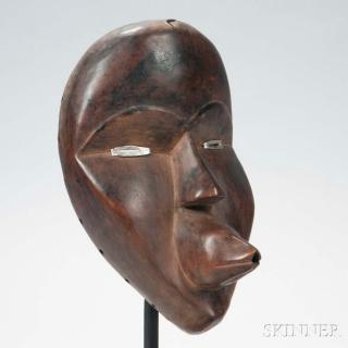 Appraisal: Dan Carved Wood Mask with metal eyes and pierced protruding