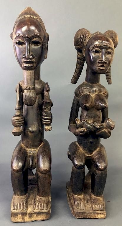 Appraisal: Baule Tribe Male and Female Figures Baule tribe carved wood