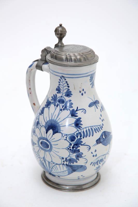 Appraisal: DELFT TANKARD Netherlands th century tin glazed earthenware Bulbous form