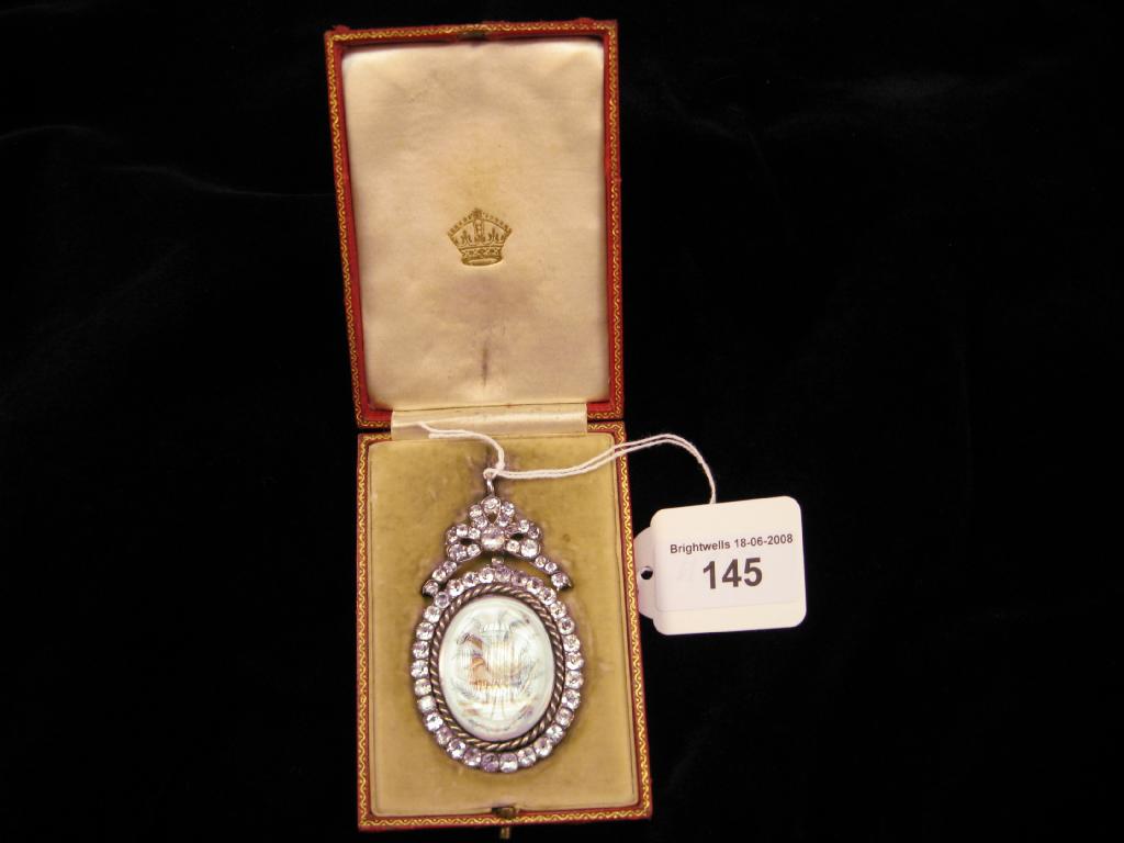 Appraisal: On oval painted Pendant the porcelain plaque painted instruments applied