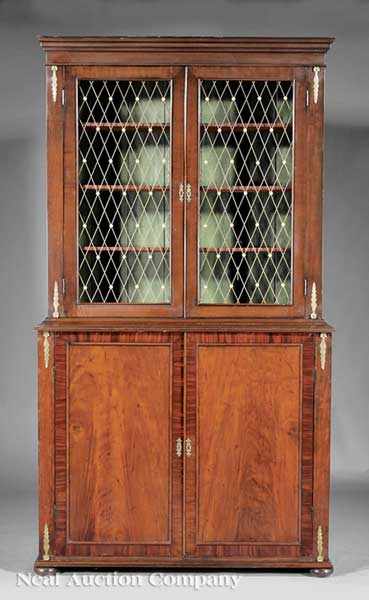 Appraisal: An Antique Regency-Style Inlaid and Brass-Mounted Mahogany Bookcase stepped cornice