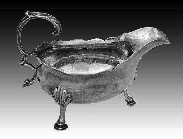 Appraisal: A GEORGE III SILVER SAUCE BOAT with wavy edge double