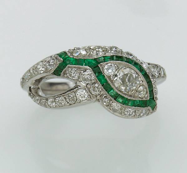 Appraisal: A diamond and emerald ring in a snake motif estimated