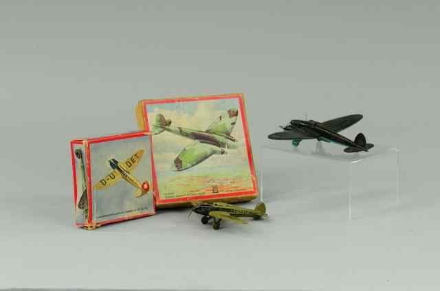 Appraisal: TWO BOXED AIRPLANES Lehmann Germany lithographed tin sold as child's