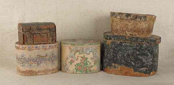 Appraisal: Four wallpaper hat boxes th c together with a wallpaper