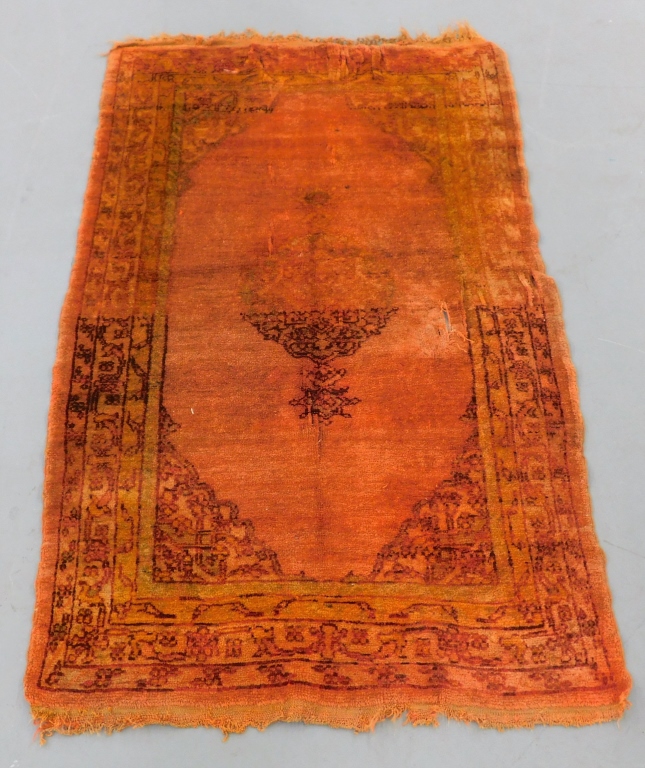 Appraisal: TURKISH ORANGE OUSHAK RUG Turkey th CenturyCentral medallion over burnt