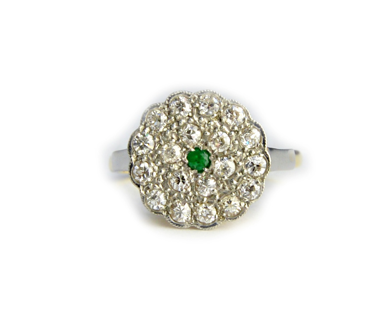 Appraisal: A gold and platinum emerald and diamond set shaped circular