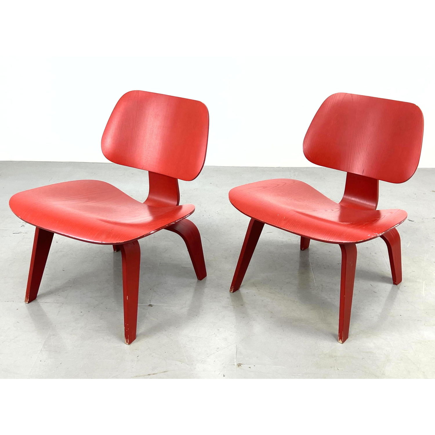 Appraisal: CHARLES EAMES for HERMAN MILLER Red LCW Chairs Wood Lounge