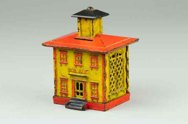 Appraisal: a CUPOLA STILL BANK Cast iron painted in yellow red