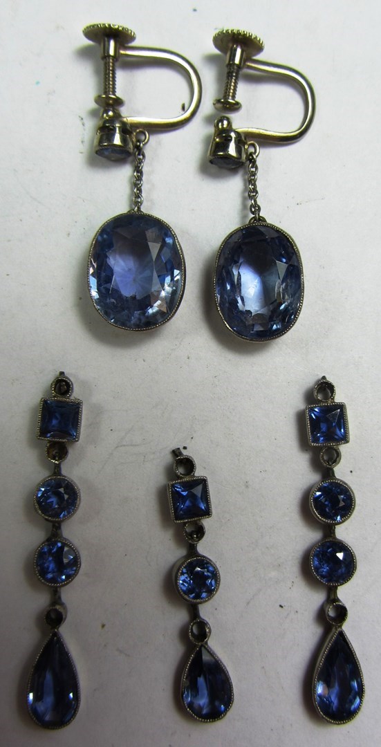 Appraisal: A pair of Ceylon sapphire set pendant earrings each drop