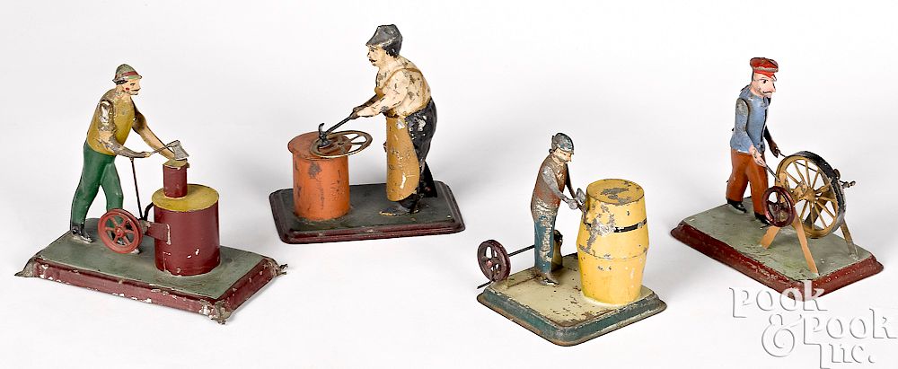 Appraisal: Four workmen steam toy accessories Four painted tin workmen steam