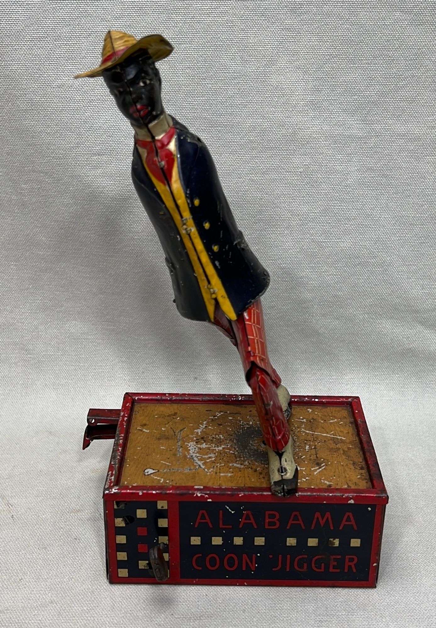 Appraisal: Lehmann Jim Crow-era tin wind-up dancer toyarms missing mechanism not