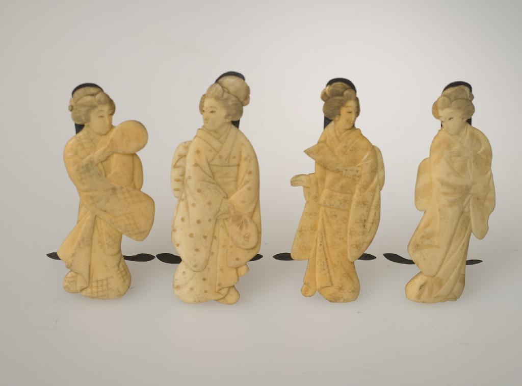 Appraisal: SET OF FOUR JAPANESE IVORY CUT-OUT FIGURES OF COURT LADIES