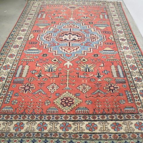 Appraisal: Heriz Persian Handmade Rug geometics and stylized florals on salmon