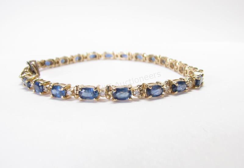 Appraisal: A K yellow gold lady's bracelet containing twenty-three oval sapphires