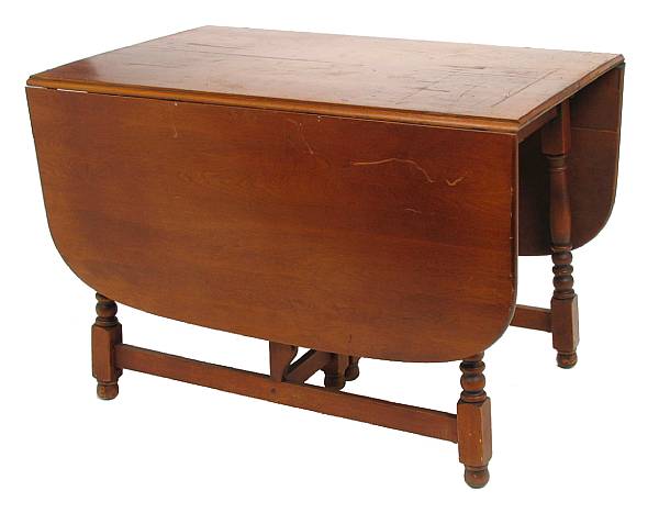 Appraisal: A cherry gate leg table with two extension leaves height