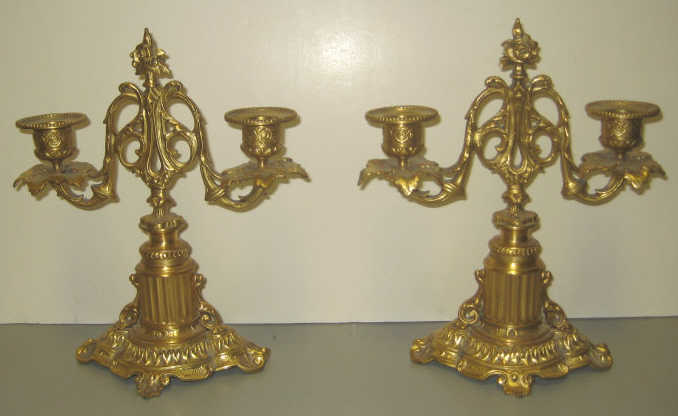 Appraisal: PAIR OF CONTINENTAL TWO-LIGHT CANDLEABRA Gilt metal with allover scrolling