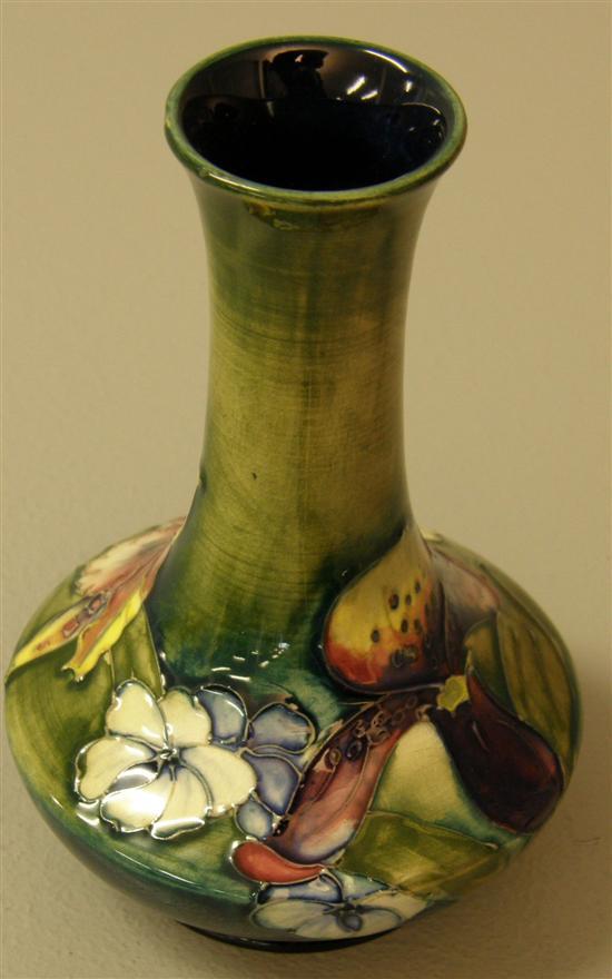 Appraisal: Moorcroft vase decorated with Irises and other flowers on a