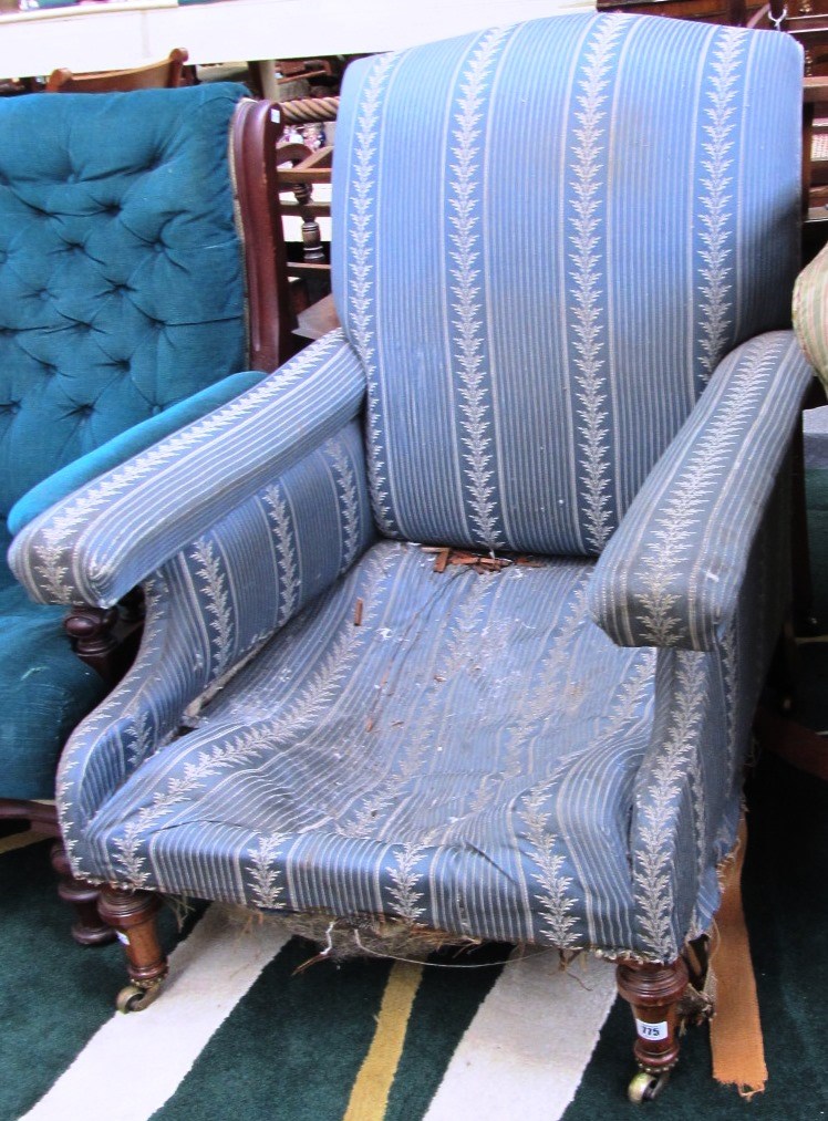 Appraisal: An early th century mahogany framed easy armchair on turned