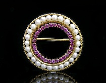 Appraisal: A Pearl Ruby Circle Brooch Pretty antique brooch set with