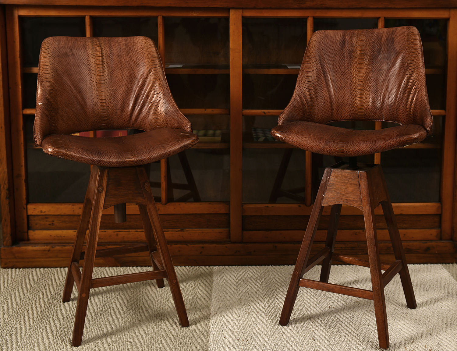 Appraisal: A PAIR OF MID TH-CENTURY SWIVEL CHAIRS IN SNAKE SKIN